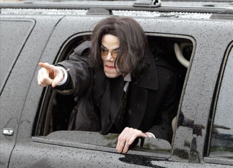 Michael Jackson leaves court in pouring rain