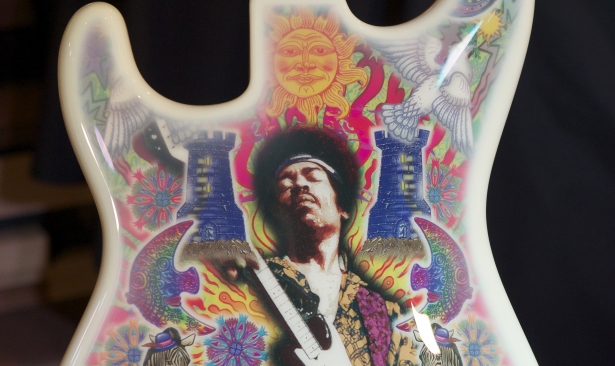 A Fender Instruments Stratocaster with artwork by Alan Aldridge is the inspiration for the Jimi Hendrix Signature Series Edition 29 merchandise including t-shirts and pins photographed at the Hard Rock Cafe Seattle in Seattle Thursday Feb. 9, 2012. Fifteen percent of the sales of the merchandise will benefit the Fender Music Foundation and the Jimi Hendrix Park Foundation. The artwork for the guitar began as a collaboration of artist Alan Aldridge and Jimi Hendrix in 1970.(Stephen Brashear/AP Images for Hard Rock International)